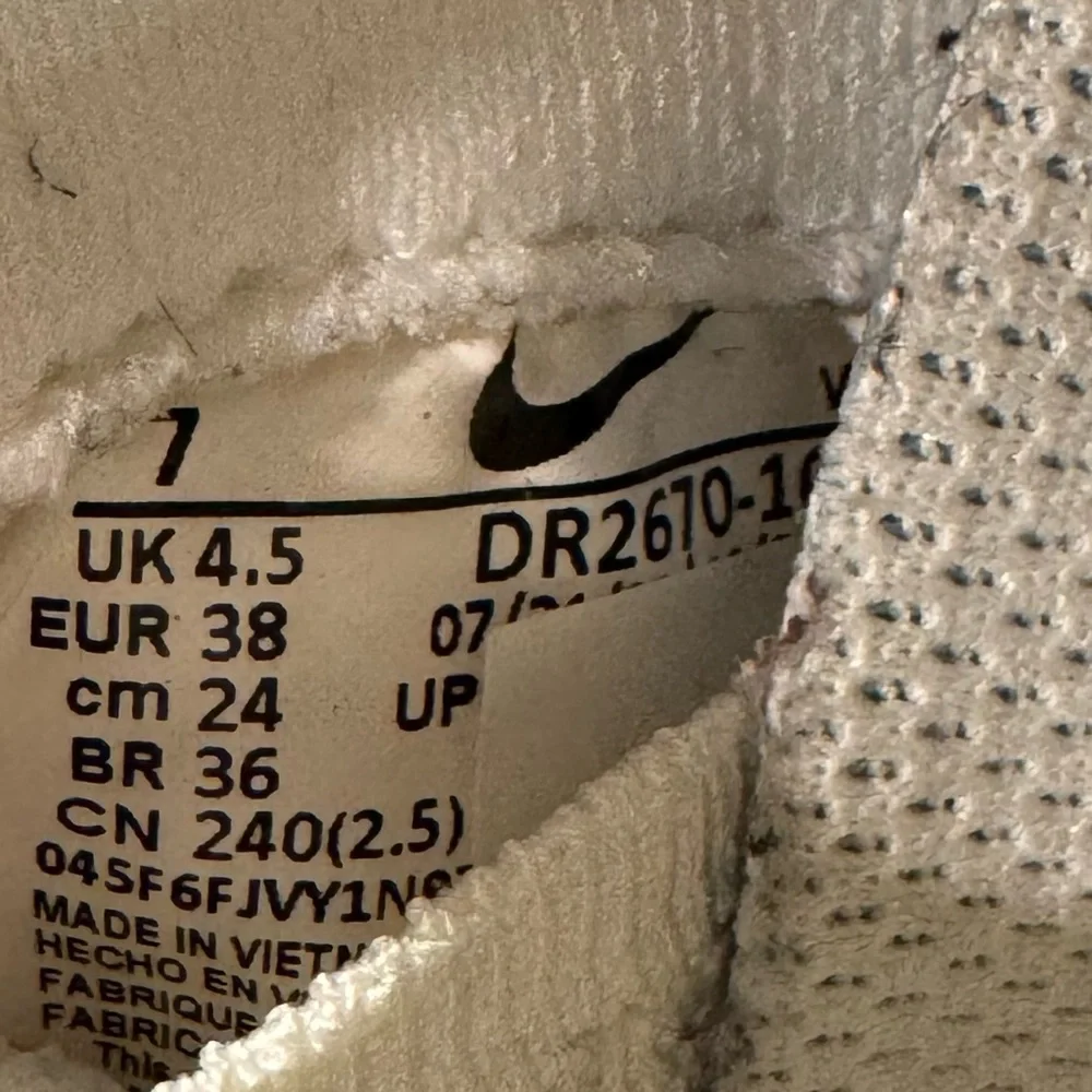 Nike Women's White Cream Running Shoes with Black Swoosh
